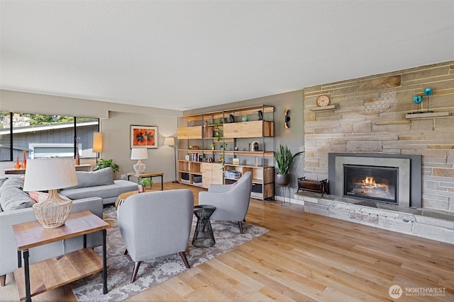 8814 Earl Ave NW, Seattle, WA 98117 - living room featuring wood finished floors and a fireplace