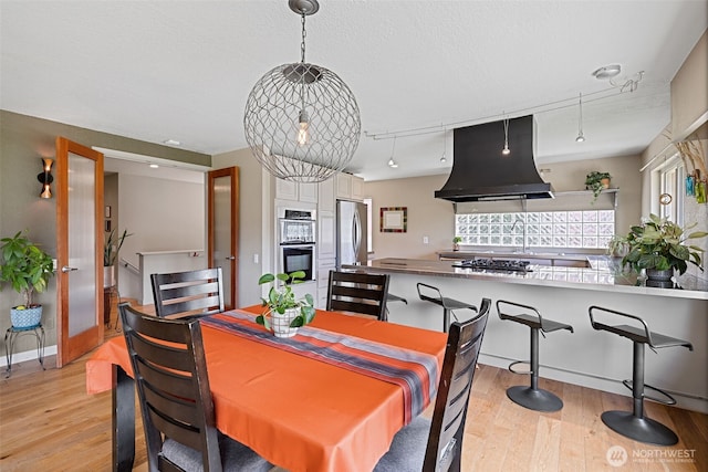 8814 Earl Ave NW, Seattle, WA 98117 - dining space featuring light wood-style floors