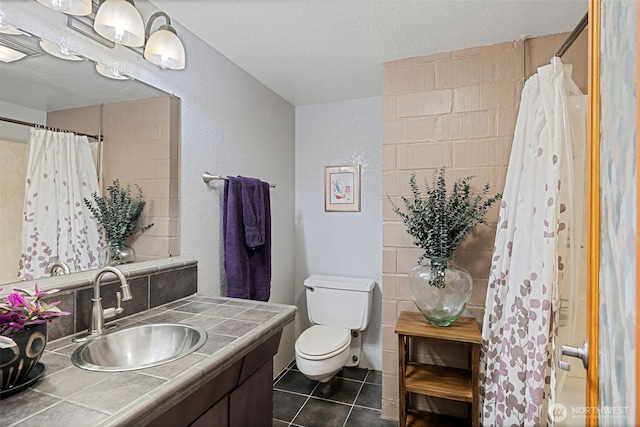 8814 Earl Ave NW, Seattle, WA 98117 - bathroom featuring vanity, tile patterned floors, a textured ceiling, a textured wall, and a shower with shower curtain