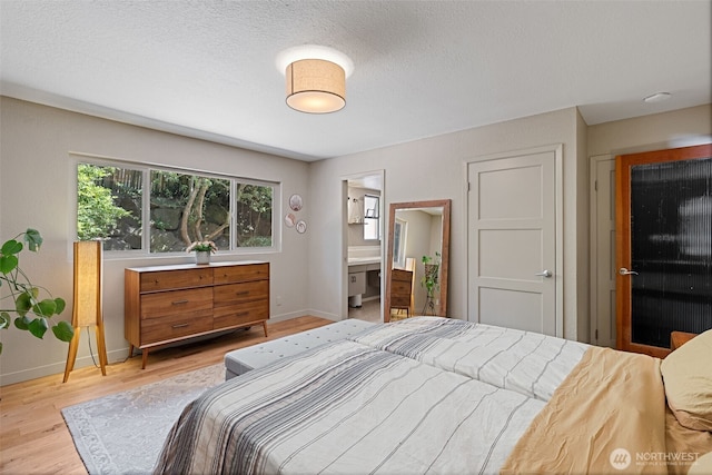 8814 Earl Ave NW, Seattle, WA 98117 - bedroom featuring baseboards and light wood finished floors