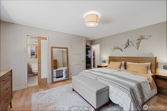 8814 Earl Ave NW, Seattle, WA 98117 - bedroom with light wood finished floors and ensuite bath