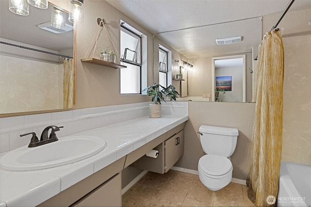 8814 Earl Ave NW, Seattle, WA 98117 - full bathroom featuring vanity, tile patterned floors, shower / bath combo, and a textured ceiling