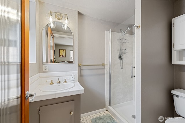 8814 Earl Ave NW, Seattle, WA 98117 - bathroom with a stall shower, vanity, tile patterned floors, and healthy amount of natural light