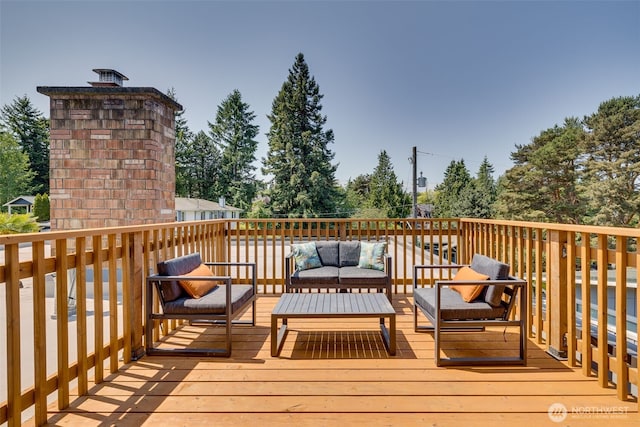 8814 Earl Ave NW, Seattle, WA 98117 - wooden deck featuring an outdoor hangout area and view of scattered trees