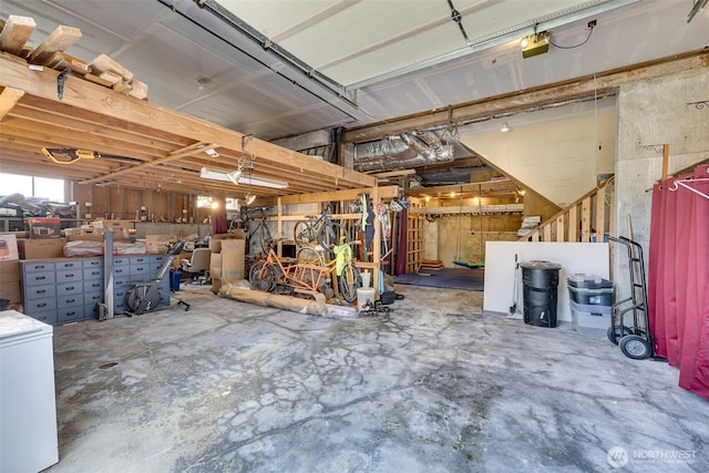 8814 Earl Ave NW, Seattle, WA 98117 - garage featuring fridge and a garage door opener