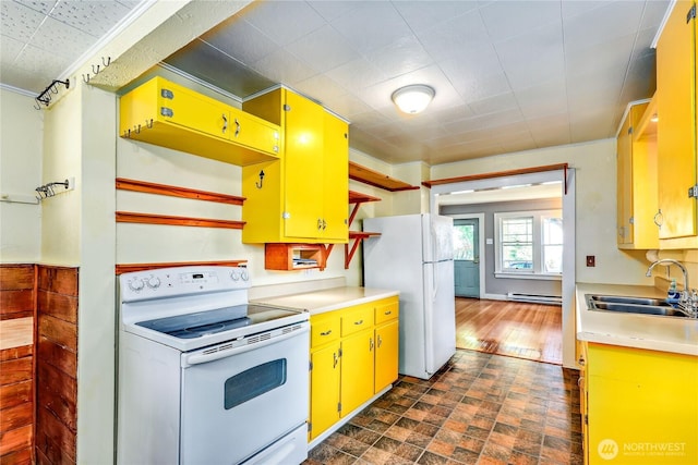 715 Grant St, Port Townsend, WA 98368 - kitchen featuring white appliances, yellow cabinets, light countertops, and baseboard heating