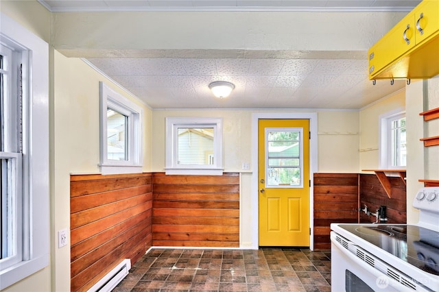 715 Grant St, Port Townsend, WA 98368 - kitchen featuring white range with electric stovetop, wooden walls, crown molding, a wainscoted wall, and baseboard heating