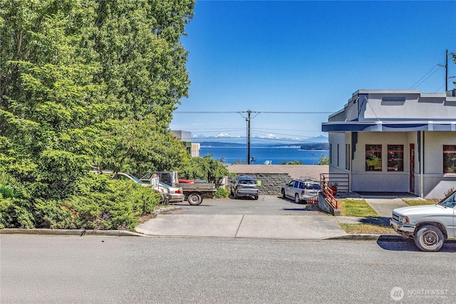 715 Grant St, Port Townsend, WA 98368 - view of front of home with stucco siding and uncovered parking