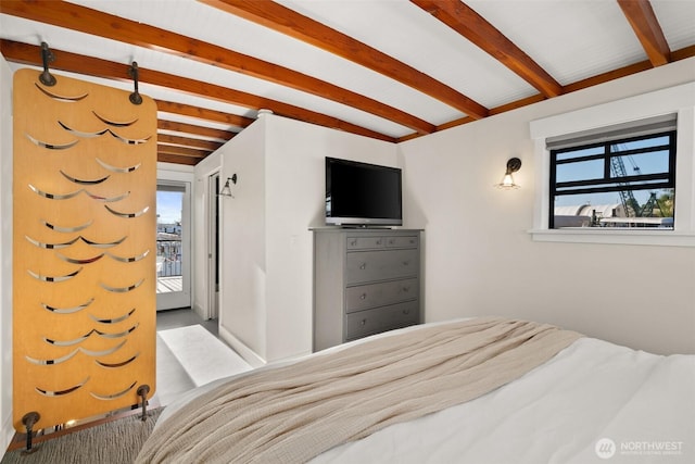360 W Ewing St Unit D3, Seattle, WA 98119 - bedroom featuring beamed ceiling, multiple windows, and access to outside