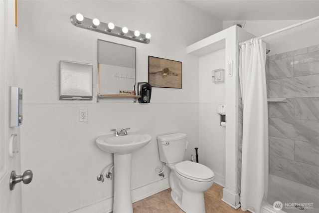 360 W Ewing St Unit D3, Seattle, WA 98119 - bathroom featuring toilet, a stall shower, and a sink