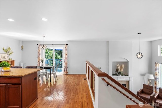 8305 172nd Pl NE, Arlington, WA 98223 - hallway featuring light wood-style flooring, recessed lighting, baseboards, and a chandelier