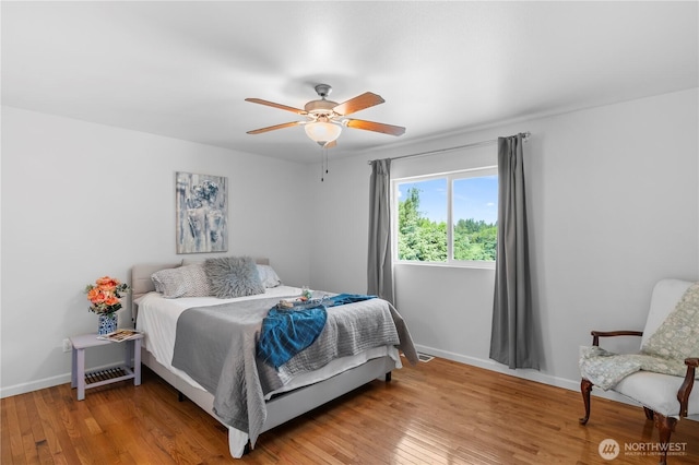 8305 172nd Pl NE, Arlington, WA 98223 - bedroom with baseboards, light wood finished floors, and a ceiling fan