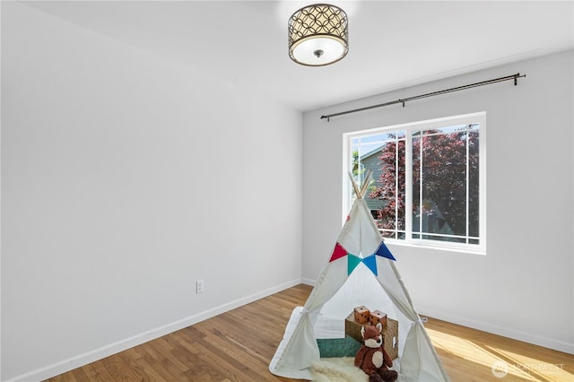 8305 172nd Pl NE, Arlington, WA 98223 - recreation room with baseboards and wood finished floors