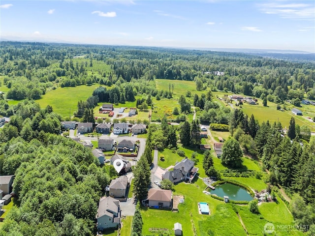 8305 172nd Pl NE, Arlington, WA 98223 - aerial perspective of suburban area with a forest and a nearby body of water