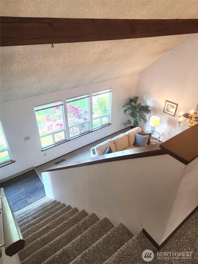 4608 73rd Street Ct E, Tacoma, WA 98443 - staircase featuring a textured ceiling, beam ceiling, and wood finished floors