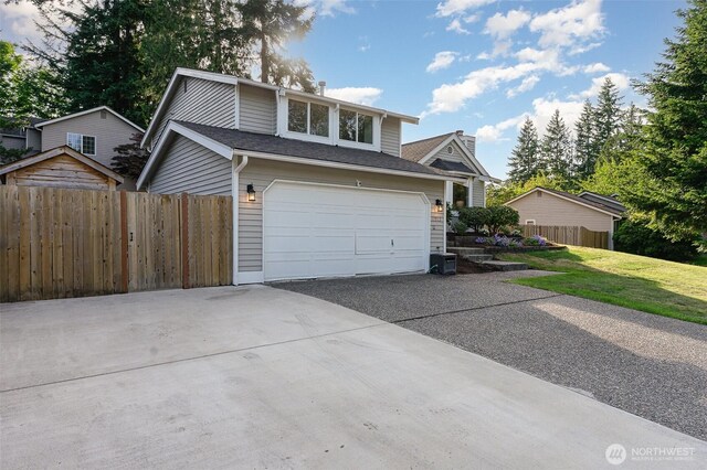 17913 158th Pl SE, Renton, WA 98058 - view of front of home featuring concrete driveway and a garage