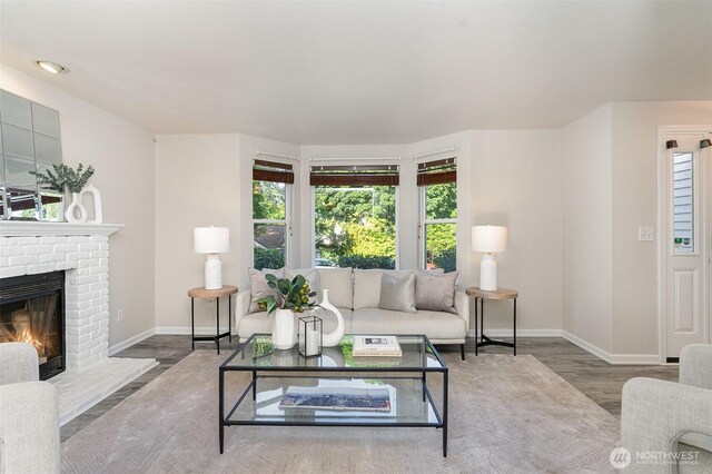 17913 158th Pl SE, Renton, WA 98058 - living area with baseboards, wood finished floors, and a brick fireplace