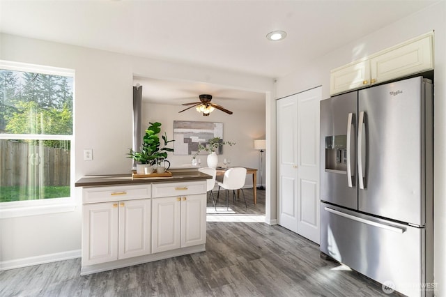 17913 158th Pl SE, Renton, WA 98058 - kitchen with stainless steel fridge with ice dispenser, healthy amount of natural light, dark countertops, wood finished floors, and recessed lighting