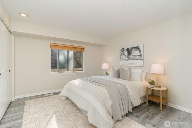 17913 158th Pl SE, Renton, WA 98058 - bedroom with wood finished floors, baseboards, recessed lighting, and a closet