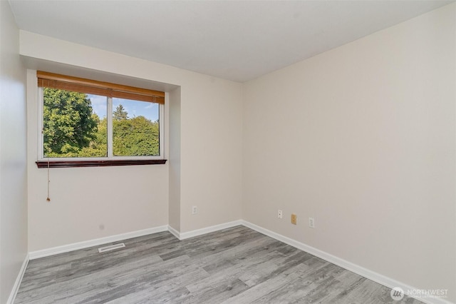 17913 158th Pl SE, Renton, WA 98058 - unfurnished room featuring wood finished floors and baseboards