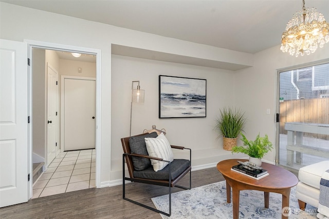 17913 158th Pl SE, Renton, WA 98058 - sitting room with a chandelier, light wood-style flooring, and baseboards