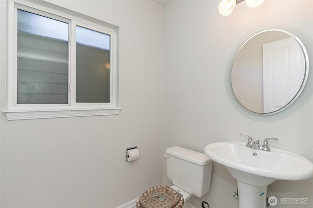 17913 158th Pl SE, Renton, WA 98058 - bathroom featuring toilet, baseboards, and a sink