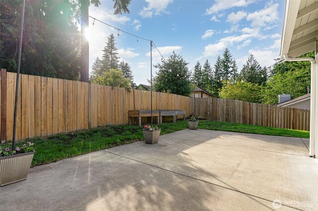 17913 158th Pl SE, Renton, WA 98058 - fenced backyard with a patio area