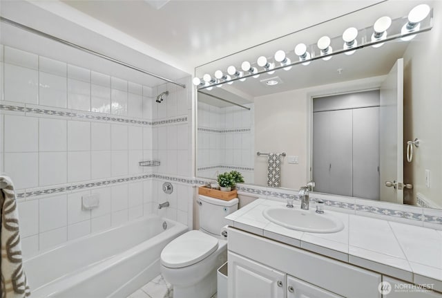 601 W Mercer Pl Unit 201, Seattle, WA 98119 - bathroom featuring vanity, washtub / shower combination, and toilet