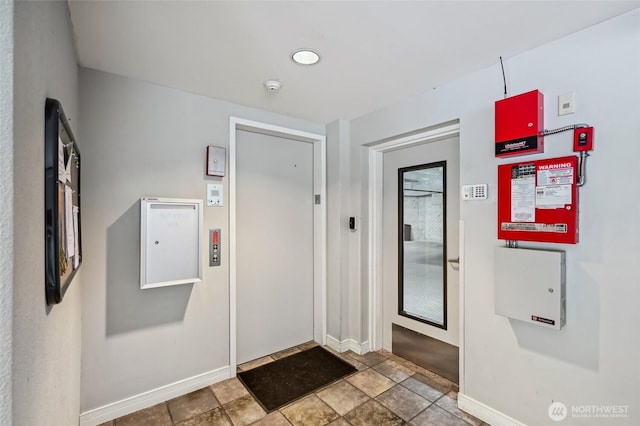 601 W Mercer Pl Unit 201, Seattle, WA 98119 - foyer entrance with baseboards and stone finish flooring
