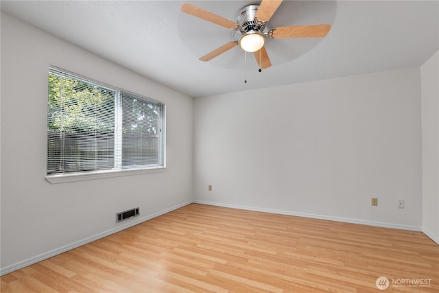 7520 208th St SW Unit A104, Edmonds, WA 98026 - empty room with light wood-style floors and a ceiling fan