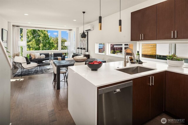 2012 14th Ave S, Seattle, WA 98144 - kitchen featuring stainless steel dishwasher, a sink, open floor plan, light countertops, and dark wood finished floors