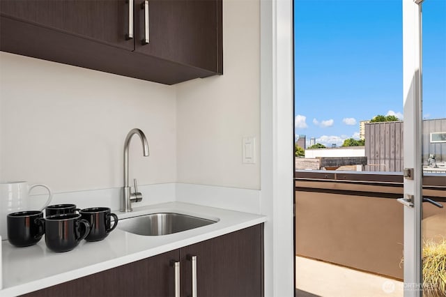 2012 14th Ave S, Seattle, WA 98144 - kitchen with dark brown cabinetry, a sink, modern cabinets, and light countertops