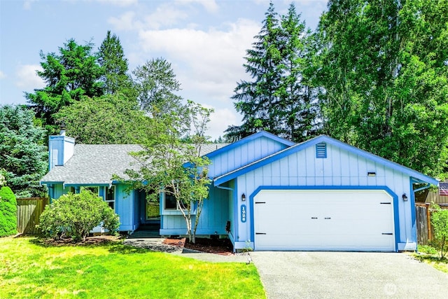 1226 Juniper Dr SE, Olympia, WA 98513 - ranch-style home featuring an attached garage, board and batten siding, a chimney, asphalt driveway, and roof with shingles
