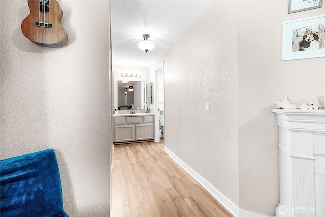 1226 Juniper Dr SE, Olympia, WA 98513 - corridor featuring light wood-style floors and a textured wall