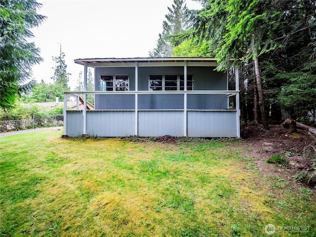 9712 Channel Dr NW, Olympia, WA 98502 - rear view of house with a lawn