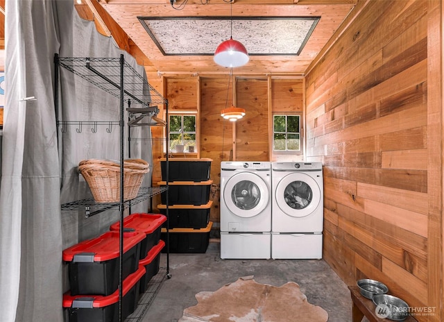 329 Columbia St, Sumas, WA 98295 - laundry area featuring washer and clothes dryer, wood walls, and plenty of natural light