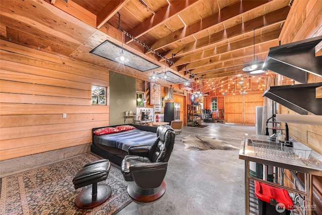 329 Columbia St, Sumas, WA 98295 - garage featuring wooden walls, wood ceiling, and freestanding refrigerator