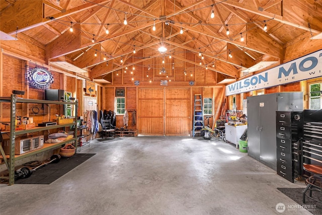 329 Columbia St, Sumas, WA 98295 - garage with a workshop area, wood walls, and wood ceiling