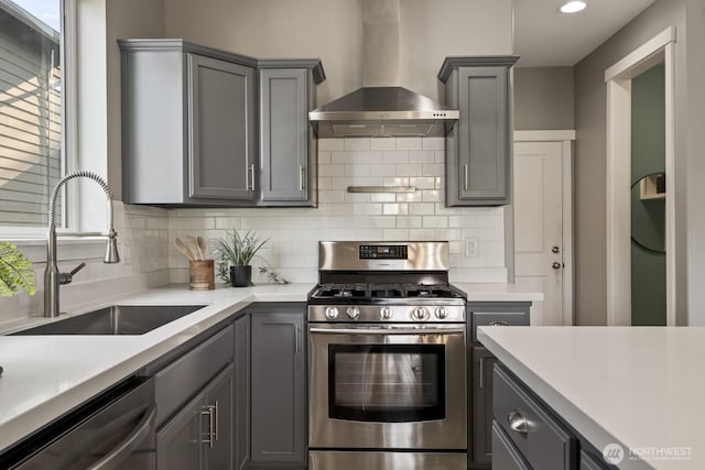 26216 SE 228th Ave SE Unit 26216, Maple Valley, WA 98038 - kitchen featuring wall chimney range hood, stainless steel gas range, dishwashing machine, gray cabinets, and recessed lighting