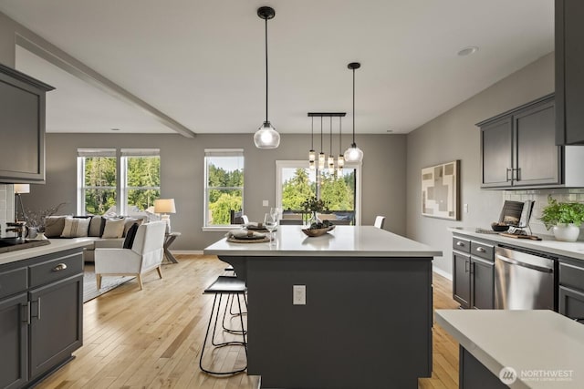 26216 SE 228th Ave SE Unit 26216, Maple Valley, WA 98038 - kitchen with stainless steel dishwasher, tasteful backsplash, and light countertops
