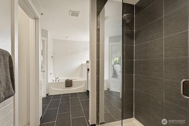 26216 SE 228th Ave SE Unit 26216, Maple Valley, WA 98038 - bathroom with a shower stall, a bath, and tile patterned flooring