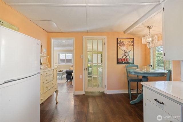 1007 N Ferdinand St, Tacoma, WA 98406 - dining room with dark wood finished floors, plenty of natural light, baseboards, and a chandelier