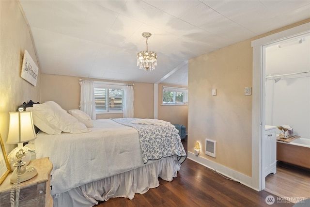 1007 N Ferdinand St, Tacoma, WA 98406 - bedroom featuring dark wood-type flooring, a chandelier, lofted ceiling, baseboards, and heating unit