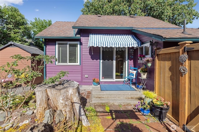 1007 N Ferdinand St, Tacoma, WA 98406 - back of property with a shingled roof