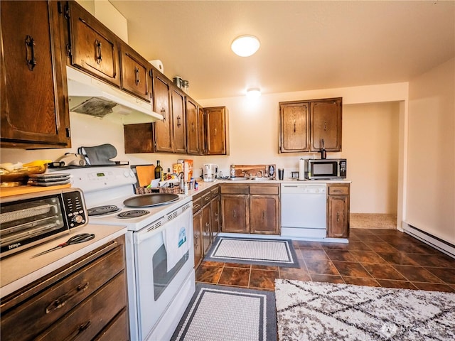 919 Harding Rd, Elma, WA 98541 - kitchen with white appliances, under cabinet range hood, light countertops, a sink, and a baseboard radiator