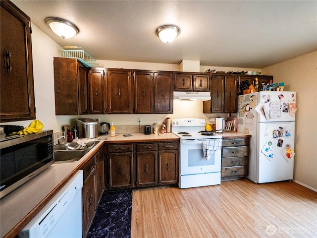 919 Harding Rd, Elma, WA 98541 - kitchen with white appliances, under cabinet range hood, dark brown cabinetry, and a sink
