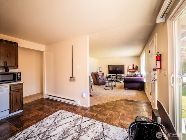 919 Harding Rd, Elma, WA 98541 - living room featuring a baseboard heating unit, dark tile patterned flooring, and dark colored carpet