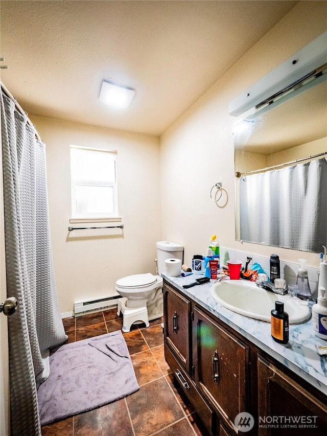 919 Harding Rd, Elma, WA 98541 - full bathroom with baseboard heating, vanity, toilet, curtained shower, and tile patterned floors