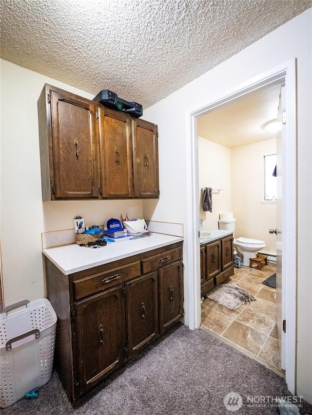919 Harding Rd, Elma, WA 98541 - bathroom with toilet, a textured ceiling, and vanity