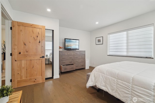 18725 NE 128th Way, Redmond, WA 98052 - bedroom with wood finished floors, recessed lighting, and multiple windows